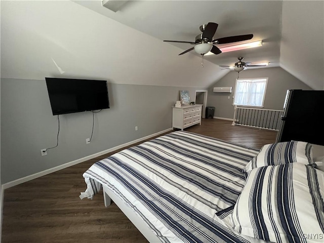 bedroom featuring baseboards, lofted ceiling, wood finished floors, and freestanding refrigerator