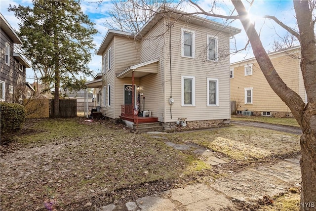 back of property featuring cooling unit and fence