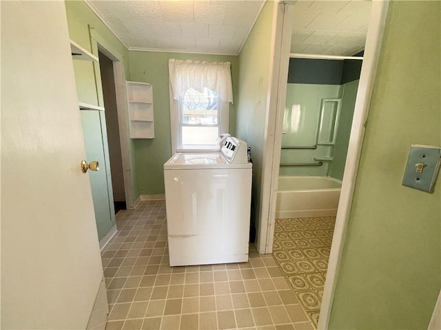 laundry area featuring washer and clothes dryer and ornamental molding