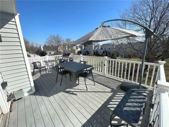 deck with outdoor dining area