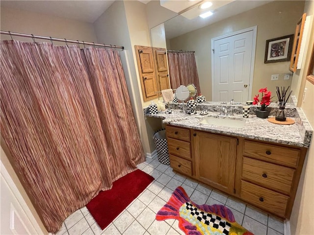 bathroom with tile patterned floors and vanity