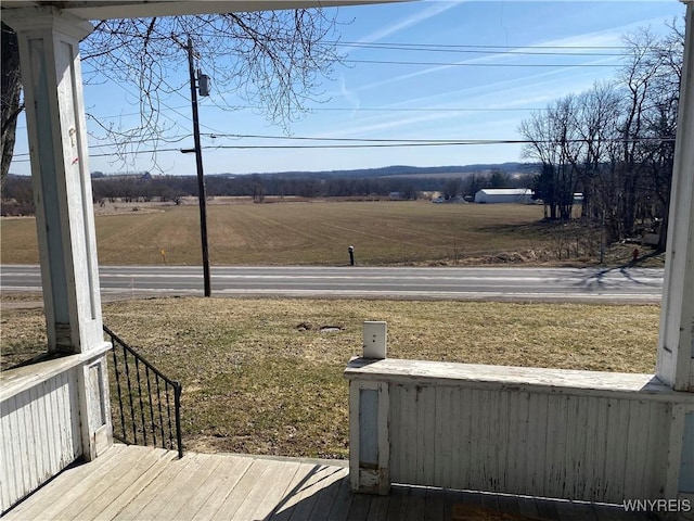 view of yard with a rural view