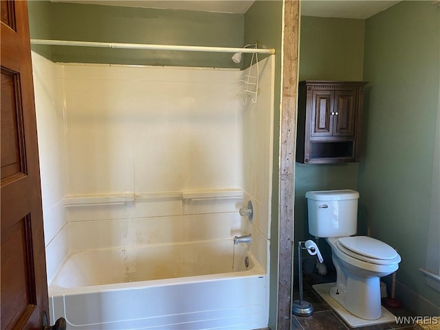 bathroom with toilet and  shower combination