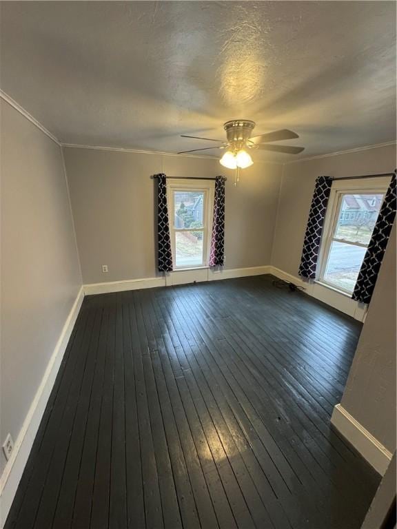 interior space with plenty of natural light, dark wood-type flooring, and baseboards