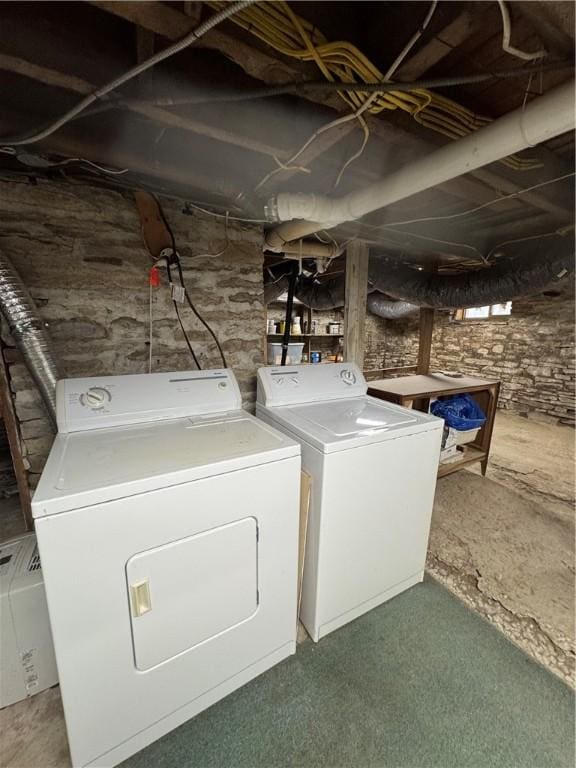 washroom featuring laundry area and washing machine and dryer