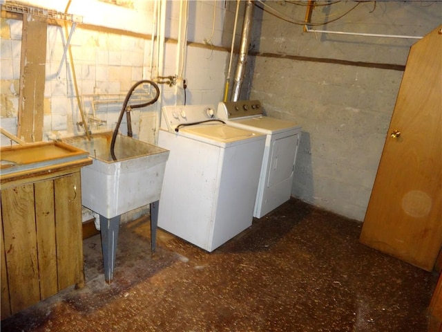 laundry room featuring tile patterned floors, laundry area, and independent washer and dryer