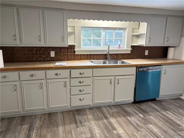 kitchen featuring a sink, open shelves, tasteful backsplash, wood finished floors, and dishwasher