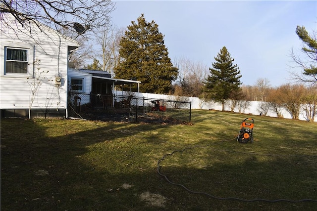 view of yard with a fenced backyard