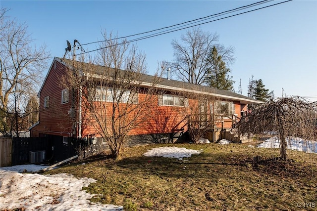 exterior space featuring cooling unit and fence