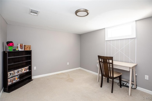 office with visible vents, light colored carpet, and baseboards