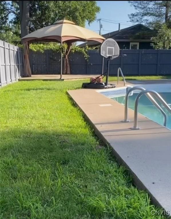 view of pool with a yard, a fenced backyard, and a fenced in pool