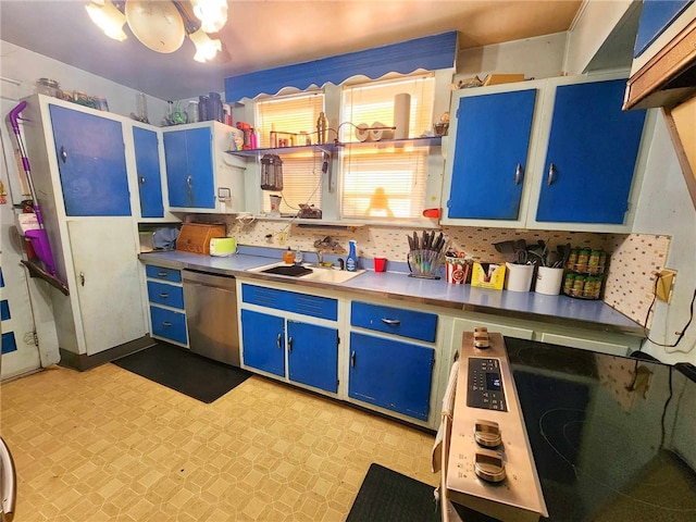 kitchen with dishwasher, blue cabinetry, light floors, and a sink