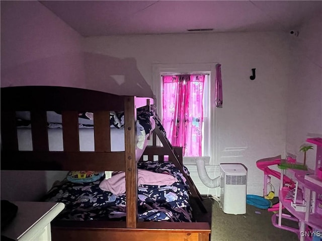 bedroom featuring visible vents and carpet floors