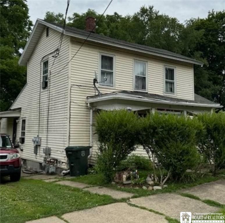 31 Hazzard St, Jamestown, NY 14701 - view of property exterior with a chimney