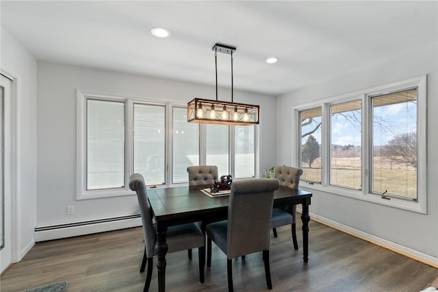 dining space featuring baseboard heating, recessed lighting, baseboards, and wood finished floors