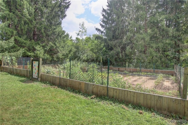 view of yard featuring a garden and fence