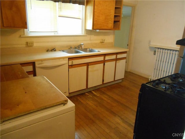 32 Fenner St, Cazenovia, NY 13035 - kitchen with a sink, wood finished floors, radiator heating unit, gas stove, and dishwasher