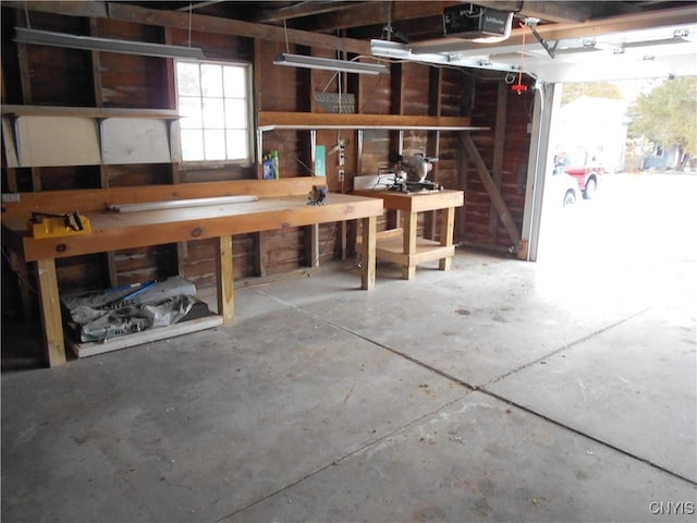32 Fenner St, Cazenovia, NY 13035 - garage with a workshop area and a garage door opener