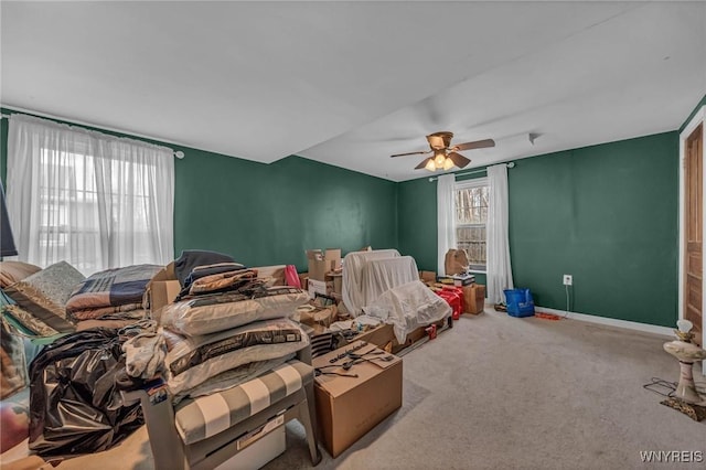 bedroom featuring carpet, a ceiling fan, and baseboards