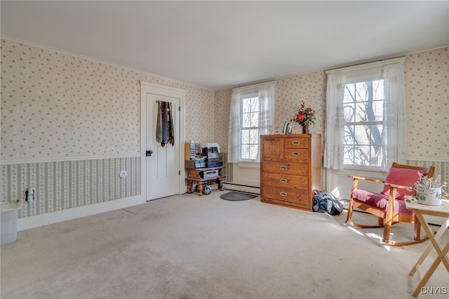 sitting room with baseboard heating, wallpapered walls, baseboards, and carpet floors