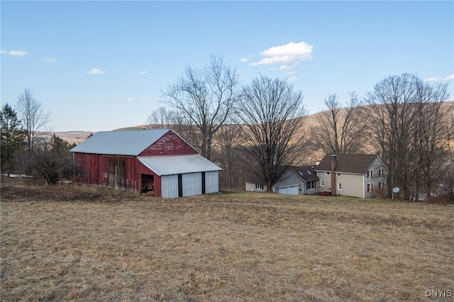 view of yard with an outbuilding and a detached garage