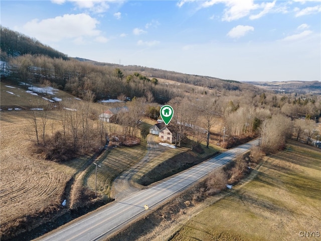 birds eye view of property featuring a rural view