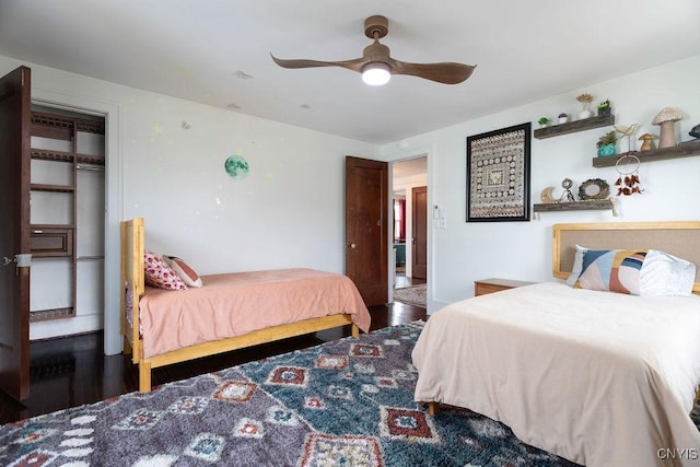 bedroom featuring a ceiling fan and wood finished floors