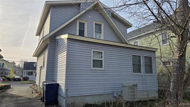 view of side of property featuring central AC unit