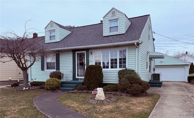 new england style home with an outbuilding, central AC, and a shingled roof