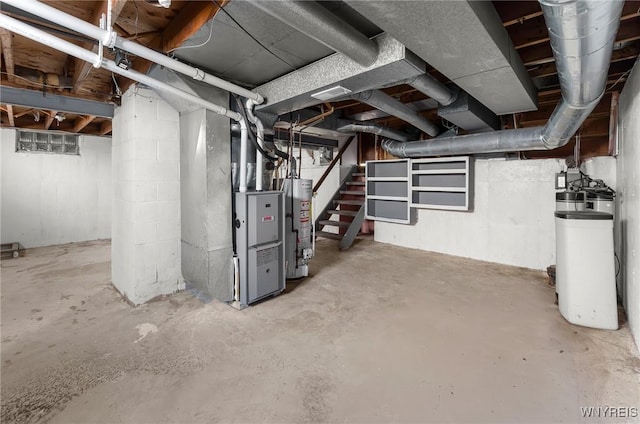 unfinished basement featuring gas water heater, heating unit, and stairs