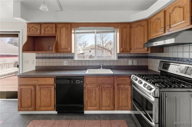 kitchen featuring under cabinet range hood, dishwasher, range with two ovens, a wealth of natural light, and a sink