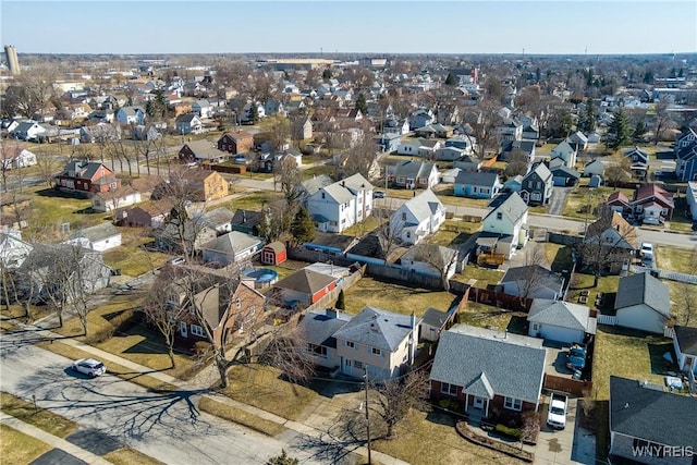 birds eye view of property with a residential view