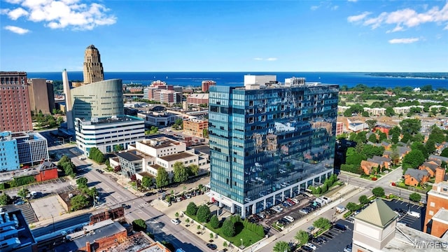 drone / aerial view featuring a water view and a view of city