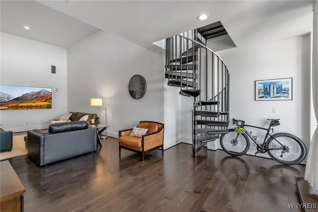 interior space featuring wood finished floors, recessed lighting, baseboards, and stairs