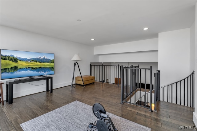 exercise area with recessed lighting and wood finished floors