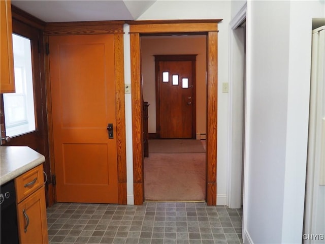 hallway with a baseboard heating unit