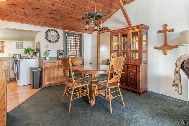 dining area with wood ceiling, carpet flooring, and vaulted ceiling