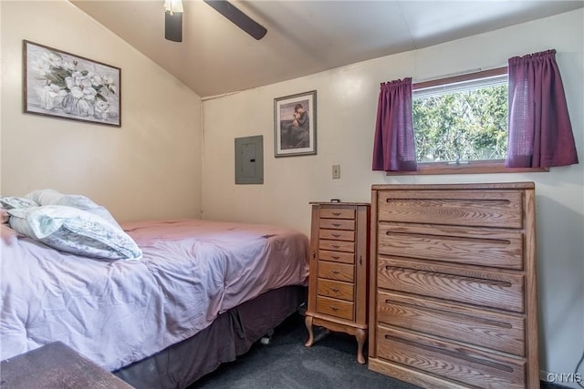 bedroom with lofted ceiling, electric panel, dark carpet, and ceiling fan