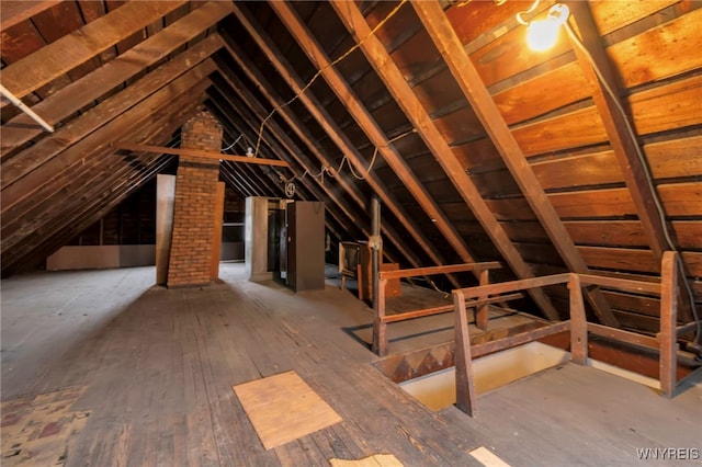 attic featuring an upstairs landing