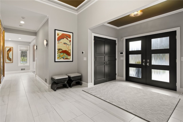 entryway featuring visible vents, french doors, crown molding, and baseboards