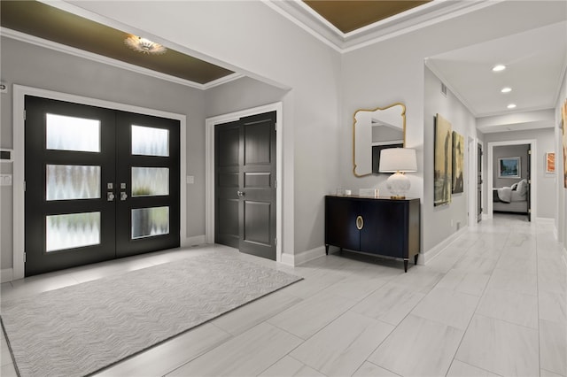 entrance foyer with recessed lighting, french doors, crown molding, and baseboards