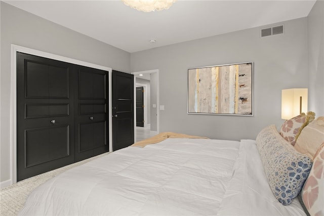 bedroom featuring visible vents and baseboards