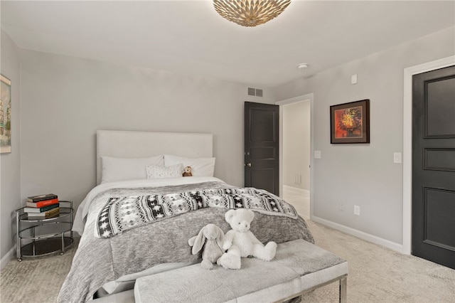 bedroom with visible vents, baseboards, and carpet