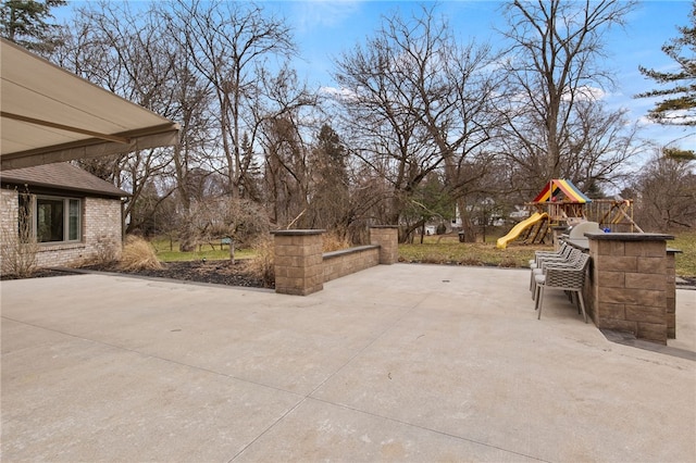 view of patio with a playground