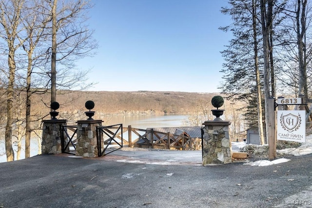 view of gate with a water view