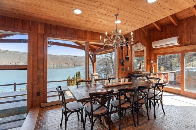 dining area featuring an AC wall unit, wooden ceiling, and wood walls