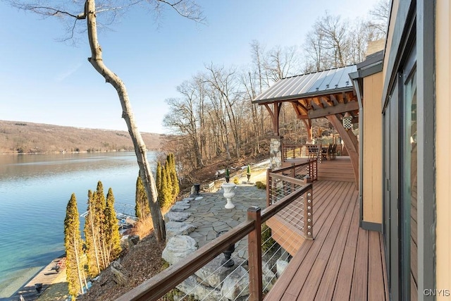 deck featuring a water view