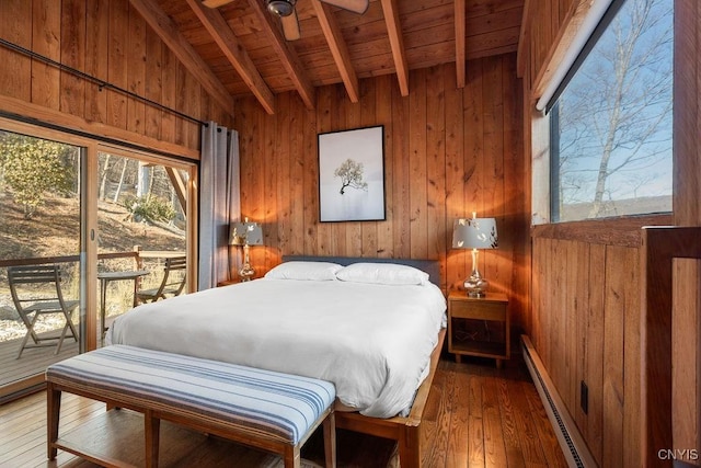 bedroom with wooden walls, a baseboard radiator, hardwood / wood-style floors, wooden ceiling, and access to outside