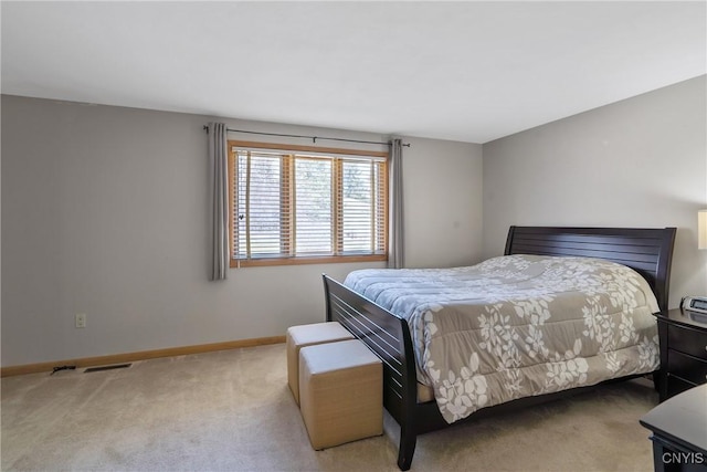 bedroom with carpet flooring, visible vents, and baseboards