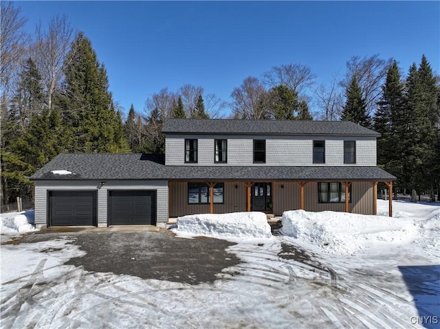 view of front facade with a porch and an attached garage